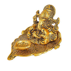 Great Art Ganesh Idol on Leaf - Lord Ganesha with Diya - Metal Hand Craved for Home Decorative Gift Puja Gifts Corporate